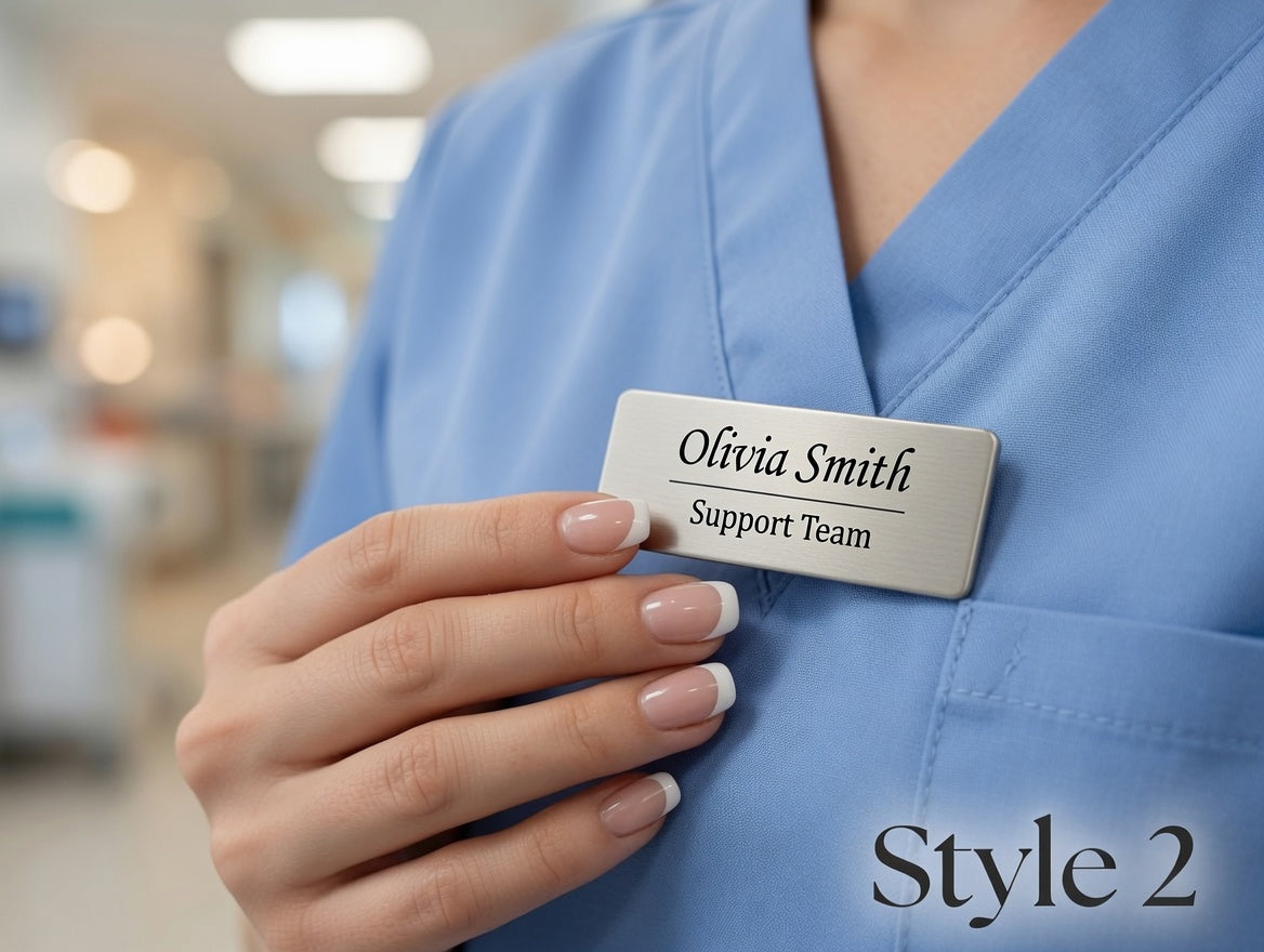 A close-up of a person in light blue medical scrubs holding a rectangular name tag that reads 'Olivia Smith Support Team.' The background is a softly blurred hospital corridor, and the text 'Style 2' appears in the lower right corner.