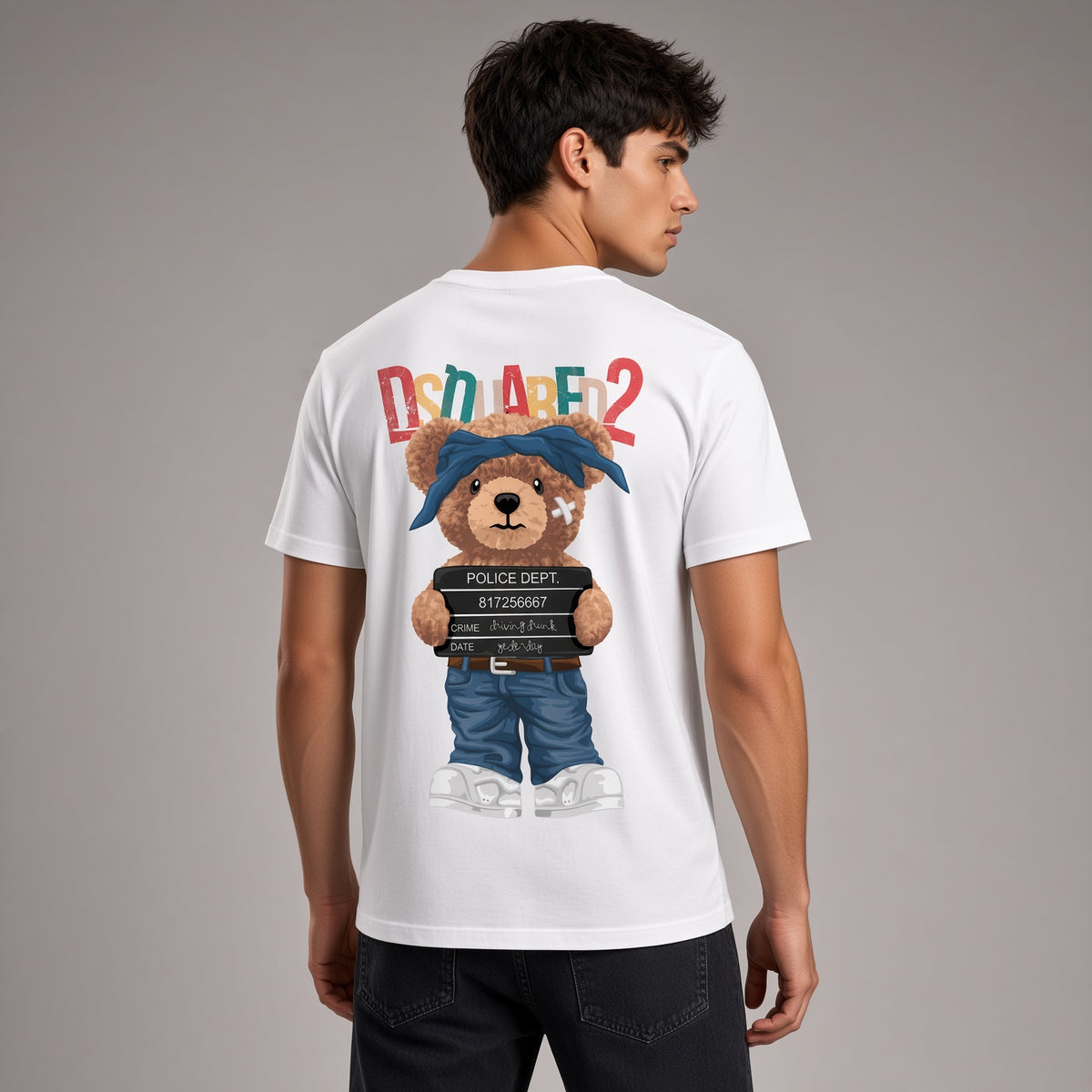 A man wearing a white t-shirt from the back, featuring a large graphic of a teddy bear dressed as a police officer holding a 'POLICE DEPT. ARREST' placard, with 'DUALER2' written above in colorful letters.
