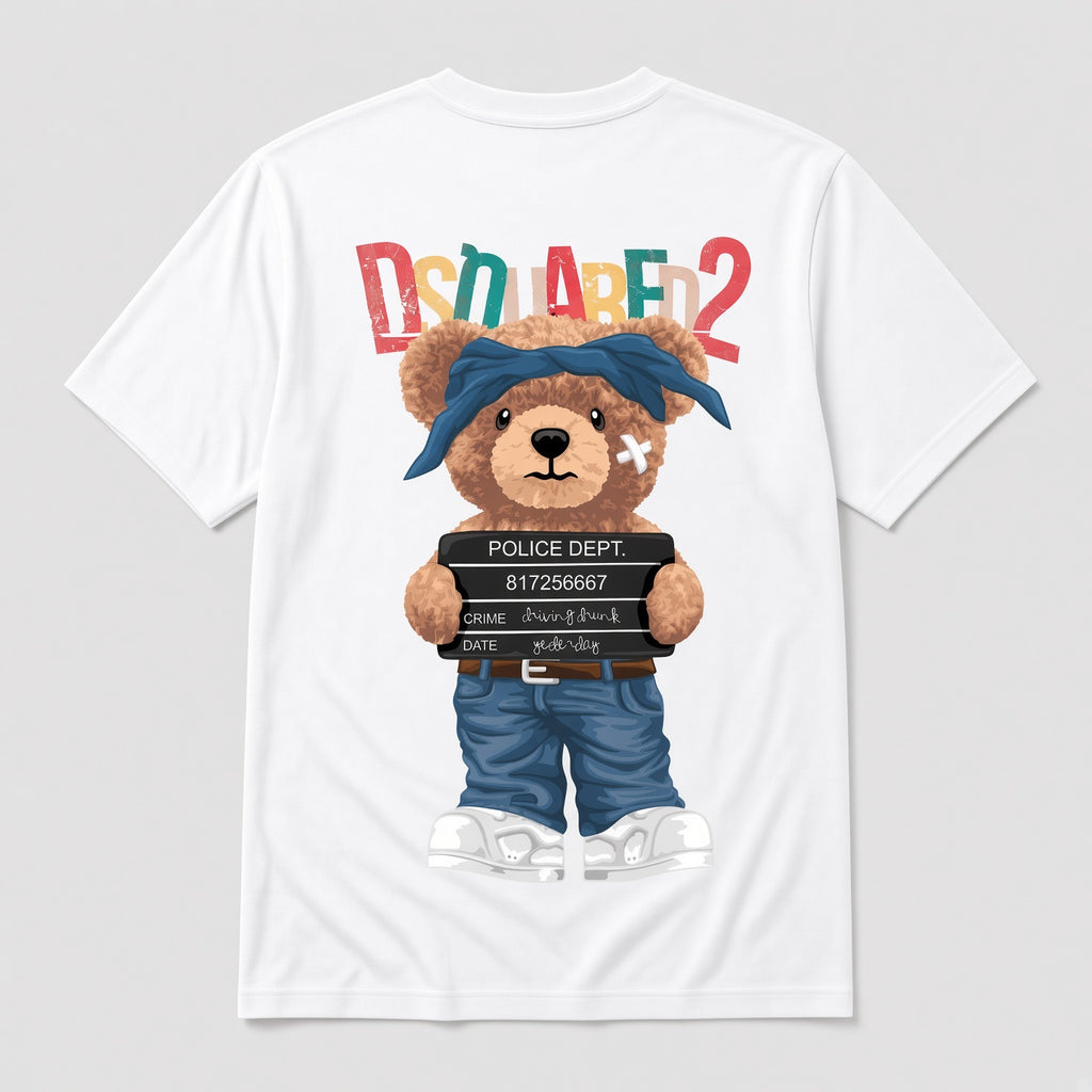 A white short-sleeve T-shirt with a large graphic print of a teddy bear dressed as a police officer, holding a police blotter, with the text 'DSQUARED2' above in colorful letters, shown on a light gray background.
