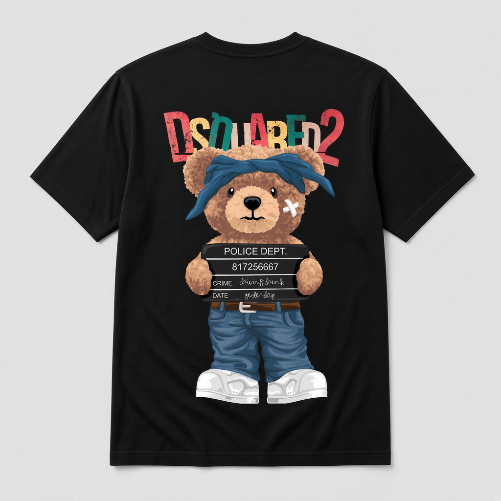 A black short-sleeve T-shirt shown flat against a light gray background, featuring a large teddy bear graphic on the front. The bear wears a blue bandana, blue shorts, and white sneakers, and holds a police block.