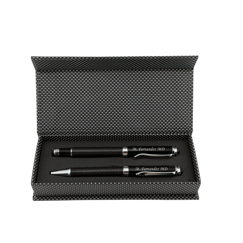 A black pen and pencil set presented in an open textured black gift box on a plain white background.