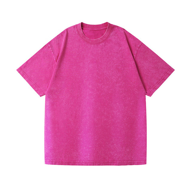 A bright pink short-sleeve crewneck t-shirt with a washed, mineral-washed texture, displayed flat against a solid white background.