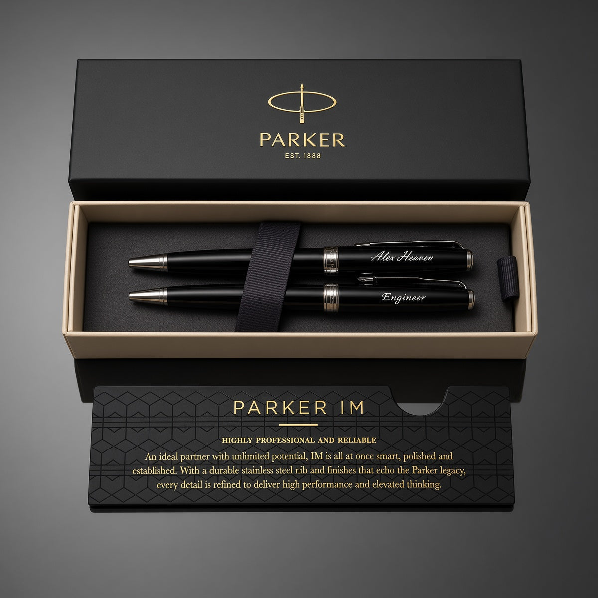 Parker IM pen set in an open black presentation box with gold trim, shown on a dark gray background. The set includes three black pens with silver and gold accents, a black ribbon, and branded packaging.