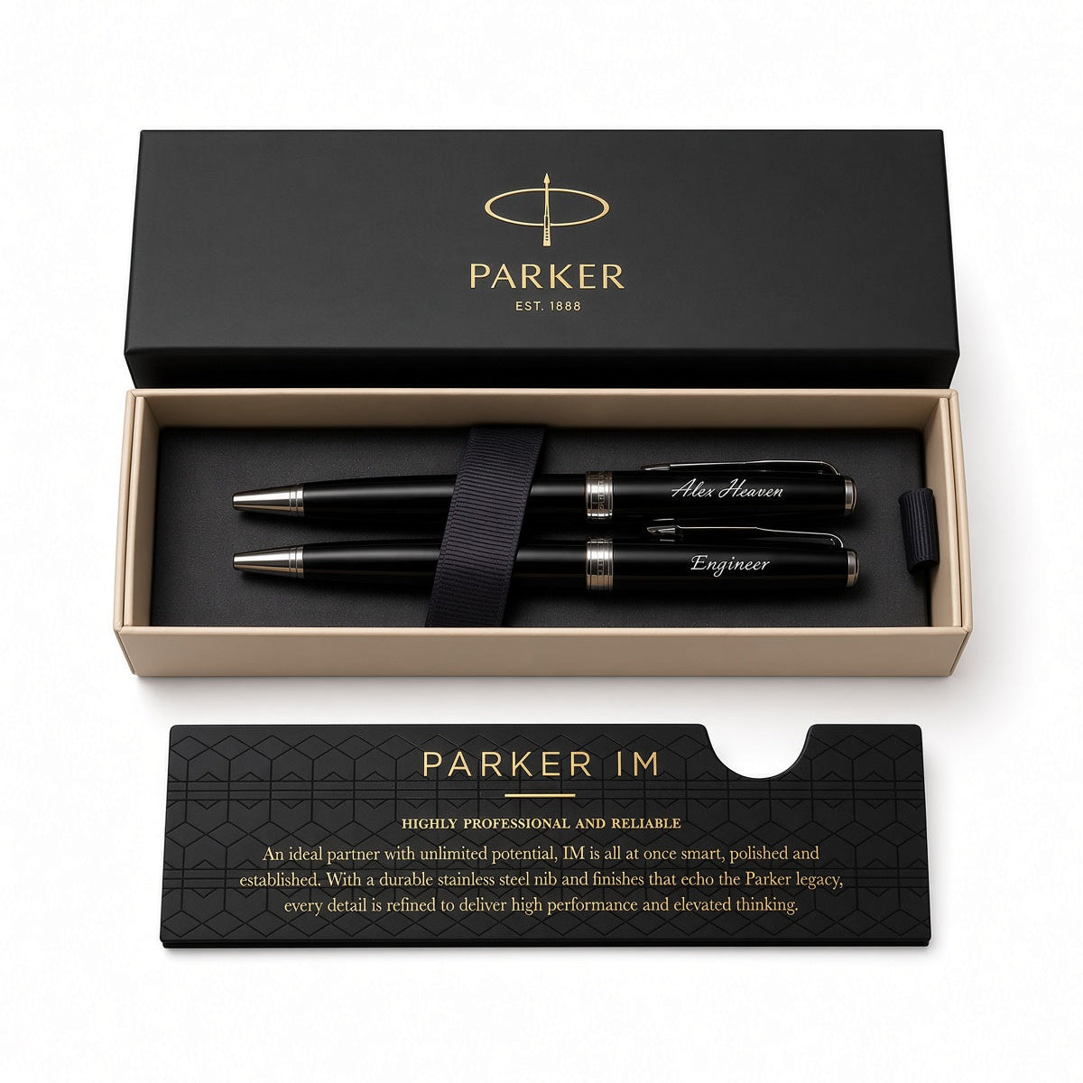 Parker IM pen set in a black presentation box with a black presentation card, photographed on a clean white background. The set includes two black pens with silver and gold accents, a black ribbon, and branded packaging.